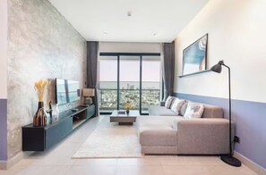 Presidential Suite, 2 Bedrooms, Club Lounge Access, City View | Living area | 65-inch Smart TV with cable channels, fireplace, Netflix