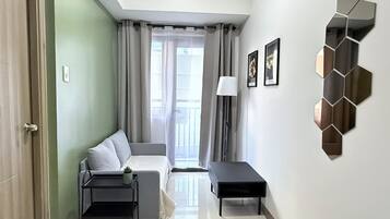 Standard Condo, 1 Bedroom, Non Smoking, Balcony | Living area | Flat-screen TV
