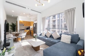 Luxury Apartment, City View | Living area | 65-inch Smart TV with cable channels