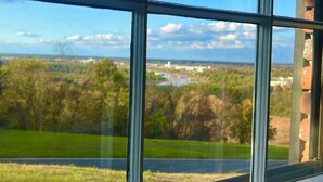 A view through a window with a clear sky and distant landscape. - Massey's in the Park (Vicksburg)
