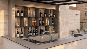 A modern bar area with a built-in wine rack and a sink. - Boutique Hotel OPERA (Rijeka)