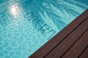 A clear pool with the word 'OPERA' written on the water's surface. - Boutique Hotel OPERA (Rijeka)