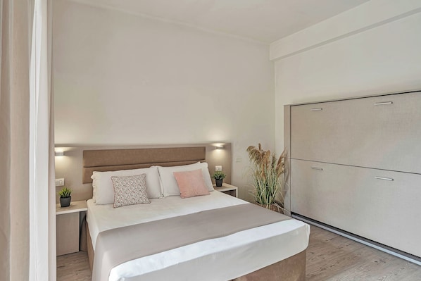 Standard Quadruple Room, Balcony, City View | In-room safe, free WiFi