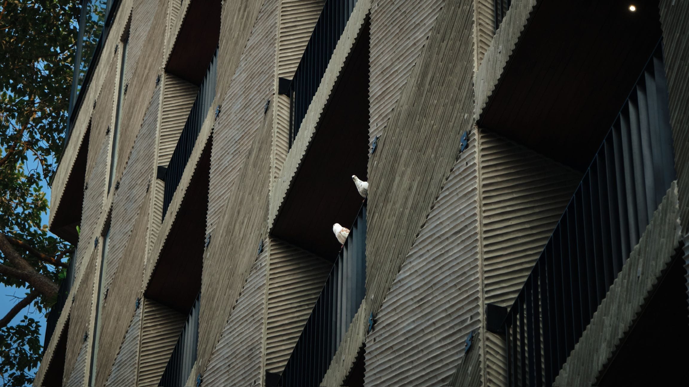 A building with a unique ribbed exterior design.
