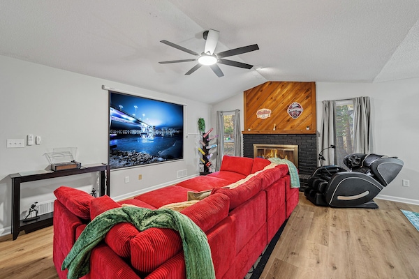 You'll enjoy a 100’’ projector screen and a massage chair that knows no stress
