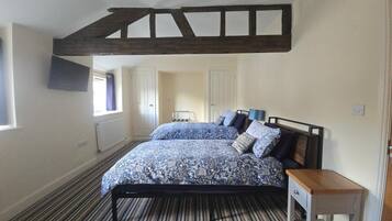 Premium bedding, down duvets, desk, laptop workspace