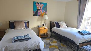 Premium bedding, down comforters, desk, laptop workspace