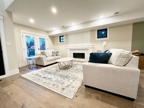 Smart TV, fireplace, foosball, books