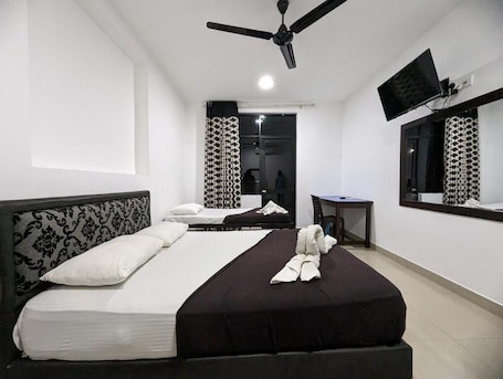 Triple Room, Balcony, Partial Ocean View | Desk, laptop workspace, soundproofing