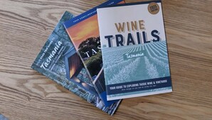 Three travel guides on a wooden surface. - South Launceston – Easy & Comfortable (Launceston City)