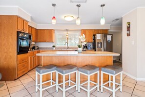 Fridge, microwave, oven, stovetop - Beautiful Riverfront House — Screened Lanai, Pool, Private Dock & Pet‑Friendly! 🌊 (Cocoa Beach)