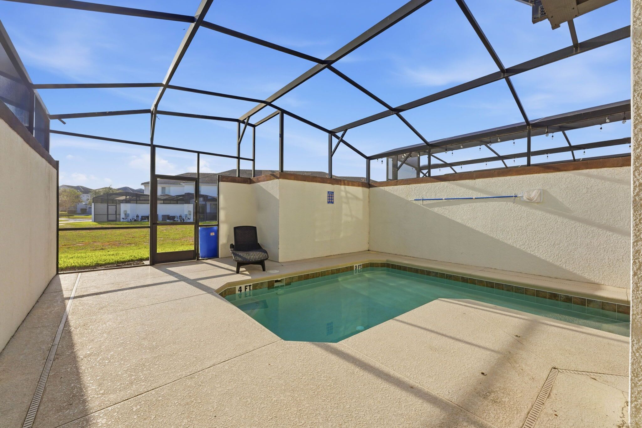 A covered swimming pool with a clear view of the surrounding area.