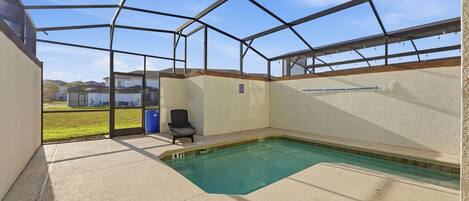 A covered swimming pool with a clear view of the surrounding area.