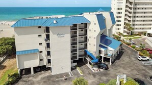 A hotel with a blue roof and a sign reading "Caprice." - 🌊 New Listing! Caprice Resort Unit #305 – Gulf Front Comfort with Private Balcony (Saint Pete Beach)