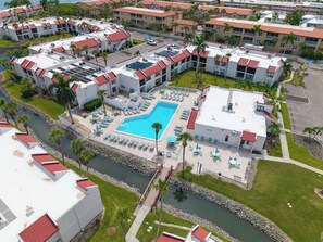 A resort with multiple buildings, a central pool area, and a river. - Hello Darling at Runaway Bay 177 (Bradenton Beach)
