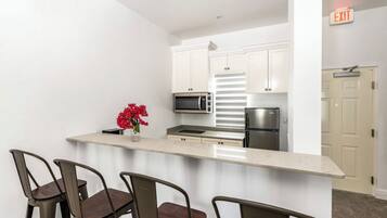 Fridge, microwave, stovetop, coffee/tea maker