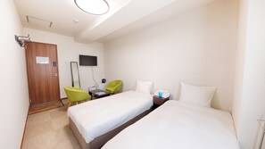 Habitación económica con 2 camas individuales | Cortinas blackout, tabla de planchar con plancha y wifi gratis