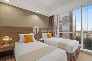 Apartment, 2 Bedrooms, City View | Desk, laptop workspace, iron/ironing board, free WiFi - Kairos by Kozystay - Pondok Indah (Jakarta)