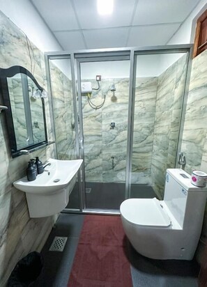 Shower, free toiletries, hair dryer, towels