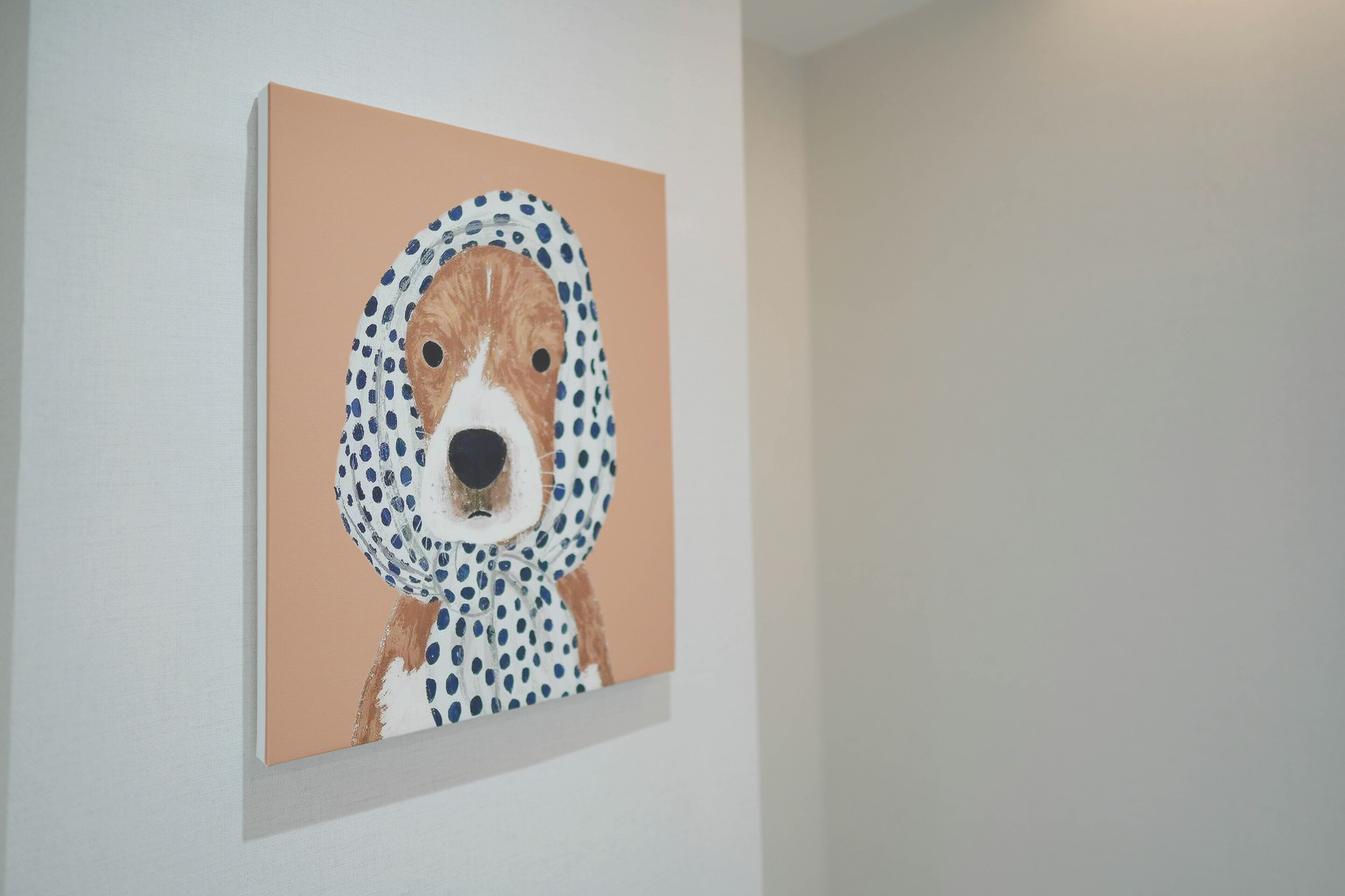 A painting of a dog on a wall.