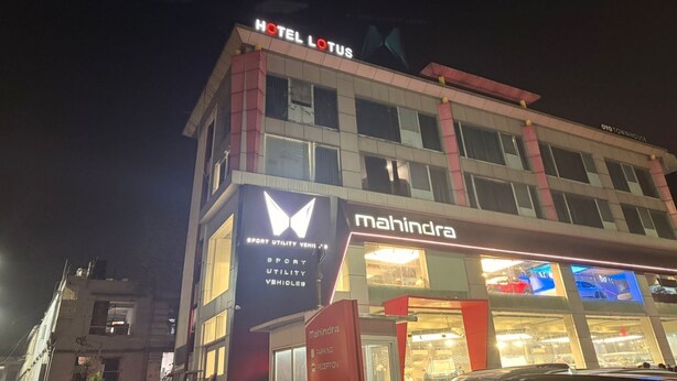 A hotel named "Hotel Lotus" with a "Mahindra" dealership below. - HOTEL LOTUS (Surat)