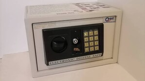 A small, white electronic safe with a keypad and a lock. - AtWhitePatong (Patong)