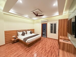 Deluxe Double Room, City View | Desk, laptop workspace, blackout drapes, iron/ironing board