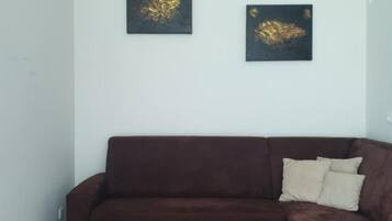 Apartment (one bedroom apartment) | Living room | 32-inch flat-screen TV with satellite channels