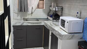 Apartamento luxo | Cozinha privada | Frigobar, micro-ondas, fogão, cooktop