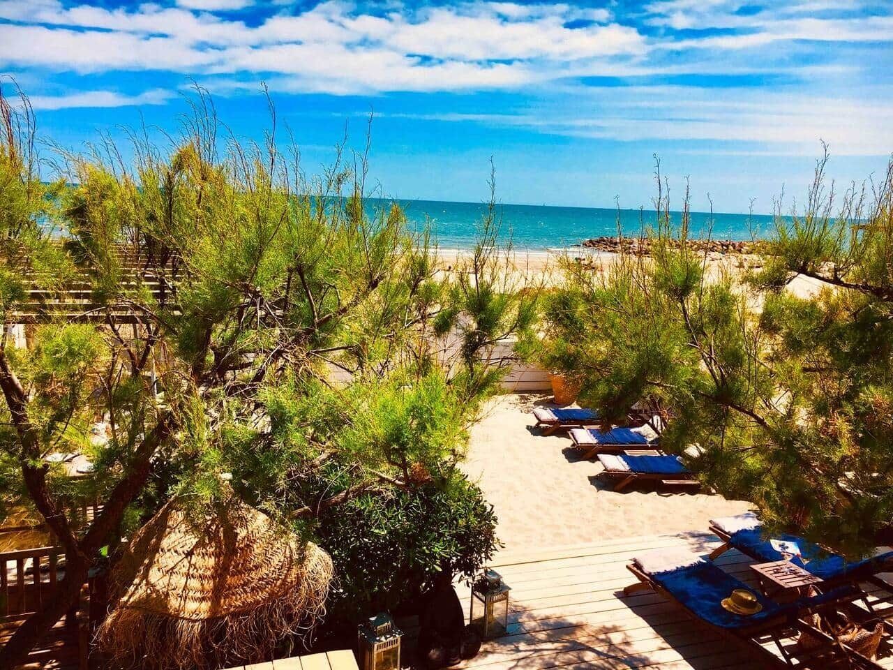 On the beach, sun loungers, beach towels