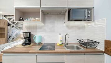 Fridge, microwave, stovetop, coffee/tea maker