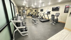 A gym with various exercise equipment, including treadmills, stationary bikes, and weight machines. - Ski-In/Out Luxury / Central Location / King, Chef’s Kitchen / Park City Mtn Base (Park City)
