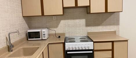 Microwave, stovetop, cookware/dishes/utensils