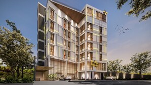 A modern multi-story hotel with a flat roof, large windows, and a covered entrance area. - Beezie Hotel (Palembang)
