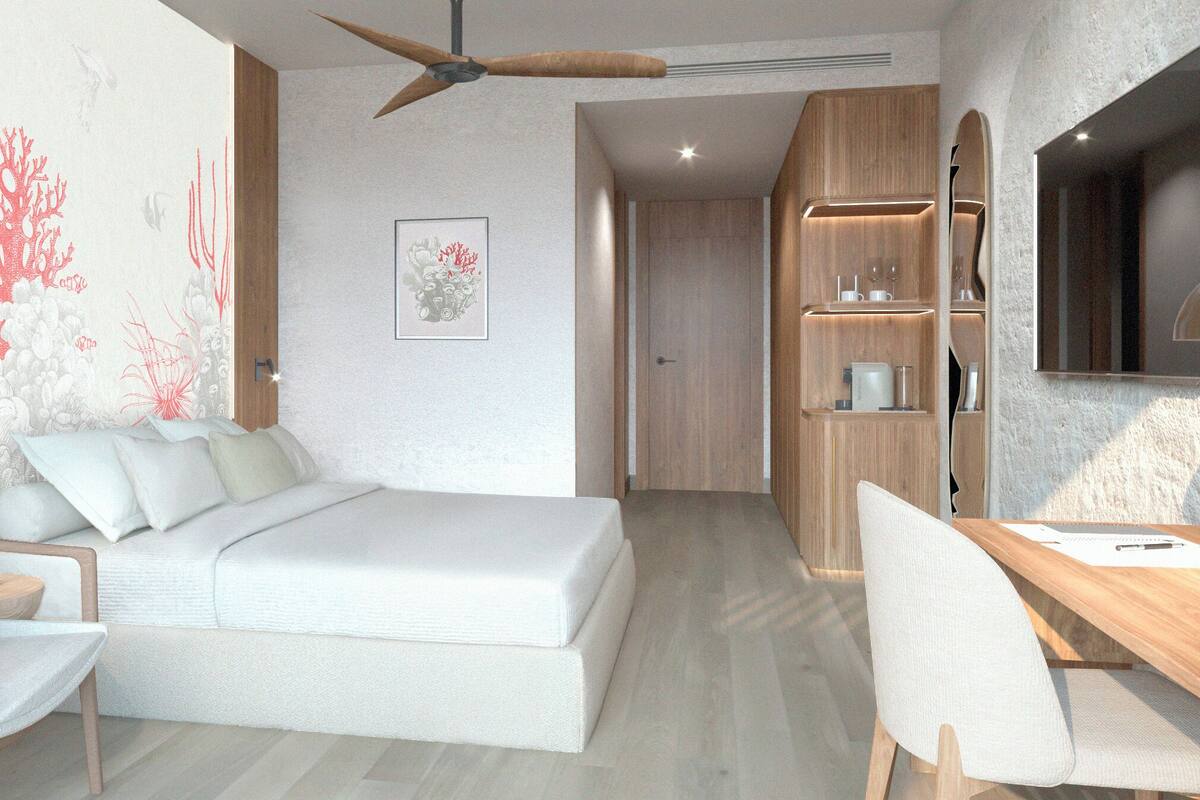 Une chambre à coucher moderne avec un lit, un bureau et une chaise.