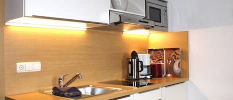 Fridge, microwave, stovetop, coffee/tea maker