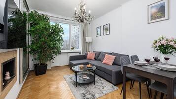 Comfort Apartment, Courtyard View | Living area | 40-inch LED TV with digital channels