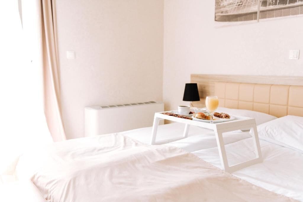 Superior Double Room, Balcony, Courtyard View | In-room safe, laptop workspace, blackout curtains, iron/ironing board