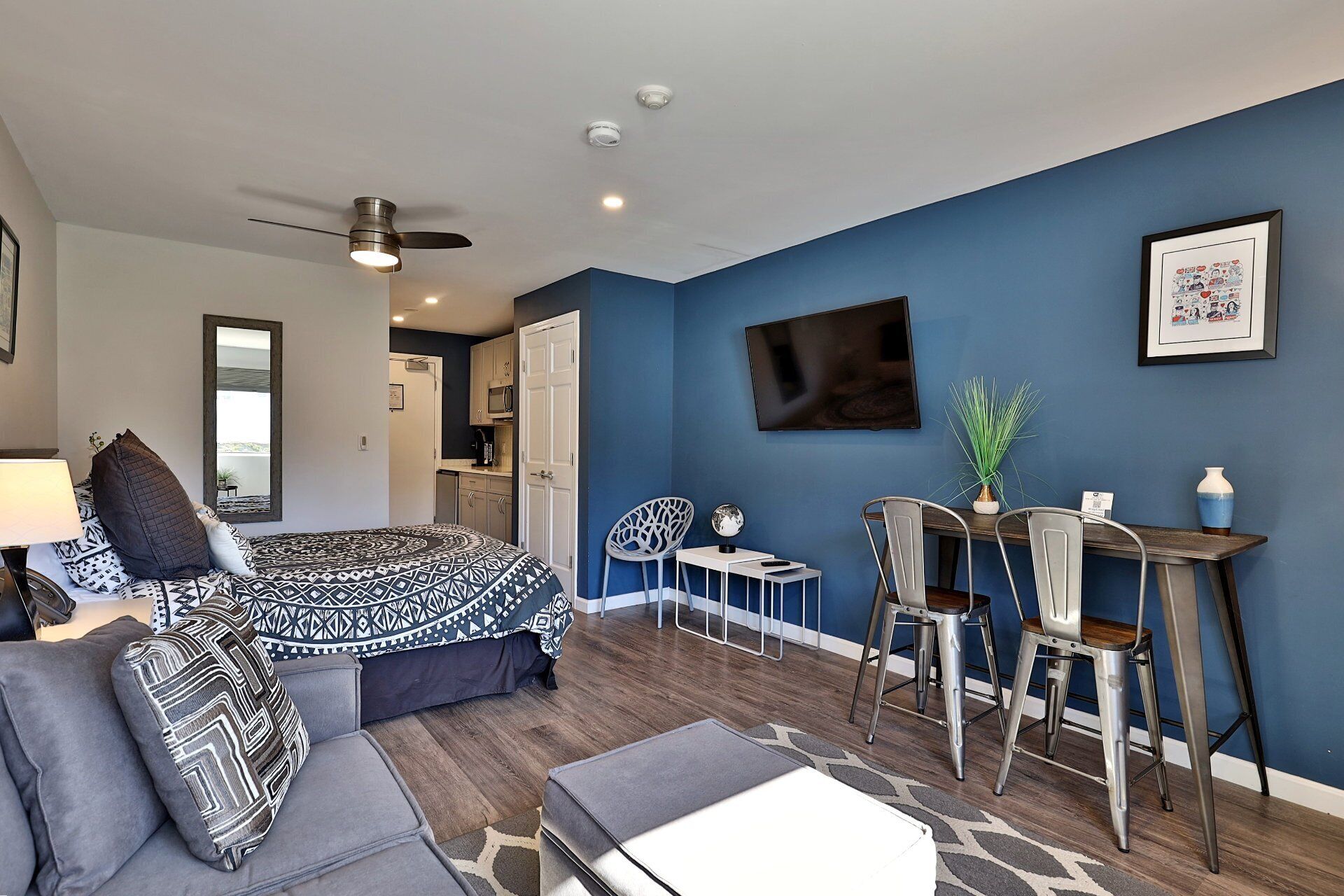 Cozy studio at Killington Center Condos. Plush queen bed, sleeper sofa, smart TV, kitchenette, and counter-height table to enjoy your meals.