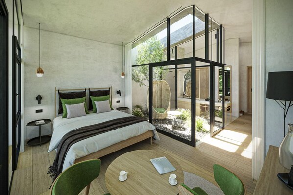 A modern bedroom with a large bed, a glass-enclosed balcony, and a dining area with chairs. - Olympic Spa Hotel (San Giovanni di Fassa)