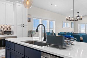 Fridge, microwave, oven, stovetop - 5228 E Beach Dr, perfect for 18 guests with a pool and dog-friendly amenities. (Oak Island)