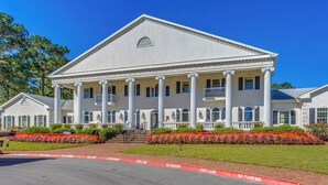 A large, stately building with a symmetrical facade, columns, and a central entrance. - Golfer's Haven: Calabash Condo, 9 Mi to Beach (Calabash)