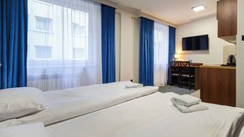 Comfort Studio Suite | Living area | 20-inch plasma TV with satellite channels