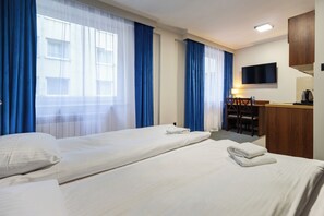 Comfort Studio Suite | Living area | 20-inch plasma TV with satellite channels