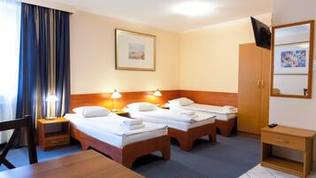 Triple Room, Kitchenette | Desk, laptop workspace, blackout curtains, iron/ironing board