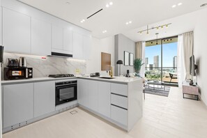 Fridge, microwave, oven, stovetop - Free housekeeping visits during your stay - StayShort - Sophisticated JVC Apartment Sleeps 4 with Balcony (JVC)