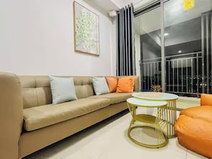 Presidential Suite, 2 Bedrooms, Club Lounge Access, City View | Living area | 65-inch Smart TV with cable channels, fireplace, Netflix - Sai Gon Airport Luxeasy Botanica Premier (Ho Chi Minh City)