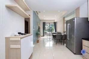 Family Suite, 3 Bedrooms, Club Lounge Access, City View | Living area | 65-inch Smart TV with cable channels, fireplace, Netflix - Sai Gon Airport Luxeasy Botanica Premier (Ho Chi Minh City)
