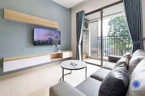 Family Suite, 3 Bedrooms, Club Lounge Access, City View | Living area | 65-inch Smart TV with cable channels, fireplace, Netflix - Sai Gon Airport Luxeasy Botanica Premier (Ho Chi Minh City)
