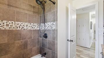 Shower, hair dryer, towels, toilet paper